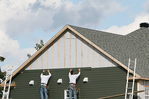 Professional Siding Contractor technician working in Braddock, PA